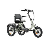 A three-wheeled electric tricycle with a light sage green frame, black tires, and a black seat with backrest, shown on a white studio background. recumbent e trike camber balance technology