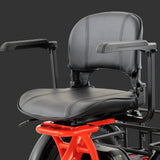 Close-up of a black padded chair  with removable armrests and a bright red frame, T5 electric trike by wired 2 ride recumbent style safe riding