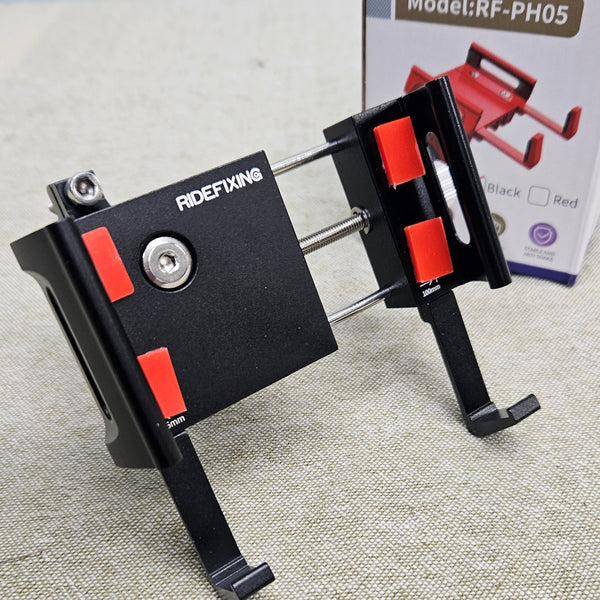 Black and red phone holder with 'RIDEFIXING' branding on a textured surface.