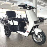 White electric scooter with large wheels in a showroom setting