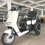 White electric scooter with a black seat in an indoor setting