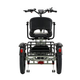 Rear view of a three-wheeled electric mobility Trike with a black seat, black handlebars, a black cargo rack, and a silver metal frame, by wired 2 ride