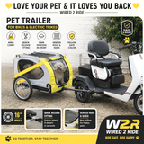 Pet trailer attached to a bike or electric trike with promotional text and branding.