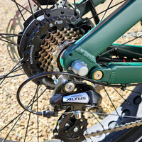 Close-up of a bicycle gear system with Shimano Altus components.